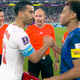 The Iranian and US captains wearing Protect Children armbands